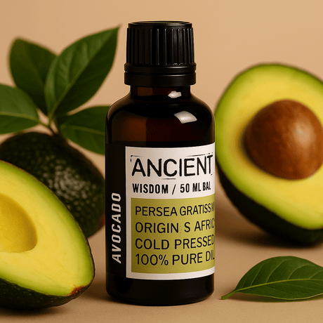 Bottle of 'Ancient Wisdom' avocado oil with avocados and leaves on a beige background