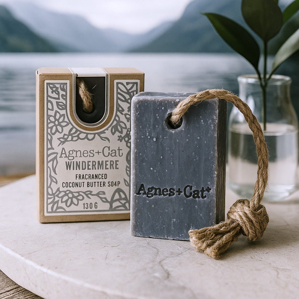Agnes + Cat coconut butter soap with packaging on a marble surface with a blurred natural background