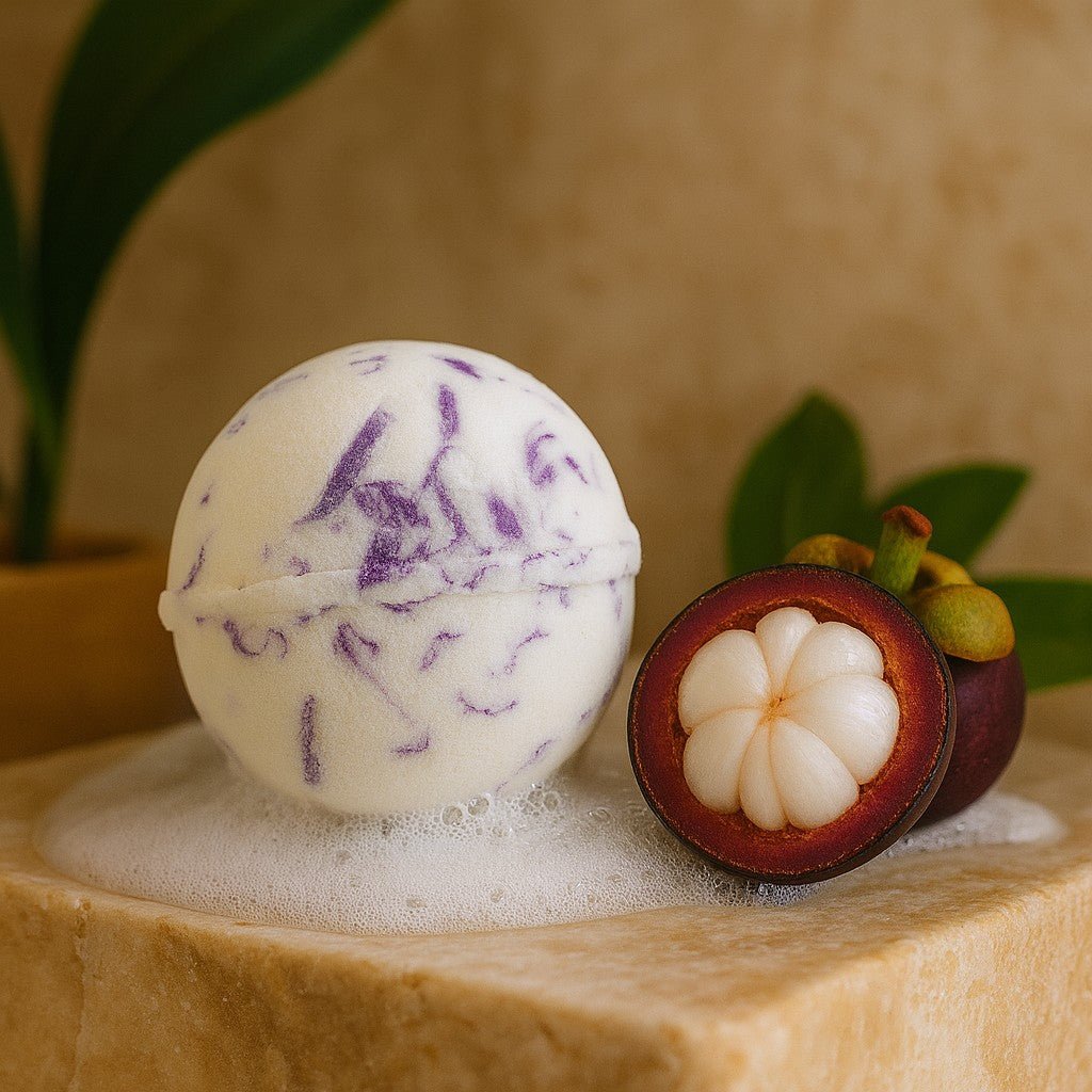 Bath bomb with purple swirls next to a halved mangosteen on a wooden surface.