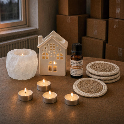 The First Evening Here: A housewarming gift: a white salt tealight holder, a little ceramic house oil burner with cedarwood oil, vanilla tealights and four jute coasters