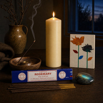 The Longest Night: A winter solstice ritual set: a tall ivory pillar, rosemary incense, a labradorite stone and a pressed-flower notebook