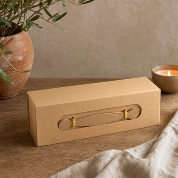 Flat Pack Gift Box - Wine Box Shape (33.5 × 10 × 10.5 cm) - Brown Craft — styled in a warm, naturally lit interior
