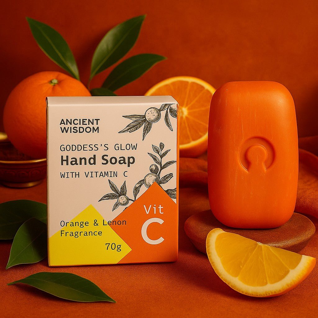 Hand soap bar with packaging on an orange background with oranges and leaves.