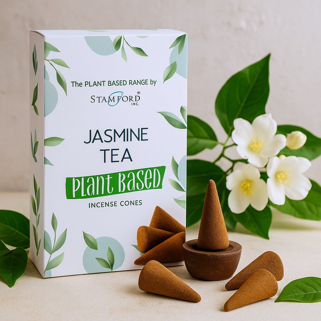 Jasmine tea incense cones with packaging and plants on a light background