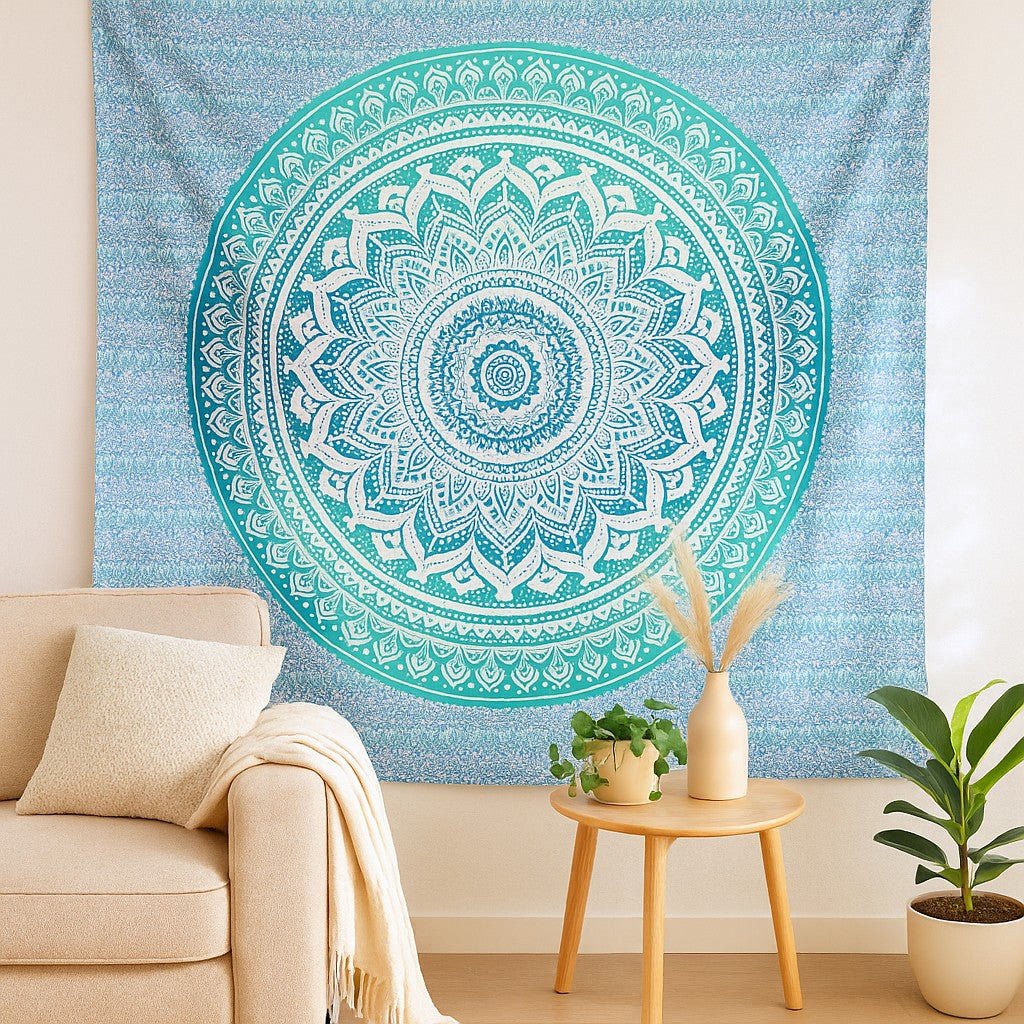 Mandala tapestry on a wall in a living room with a couch and plants.