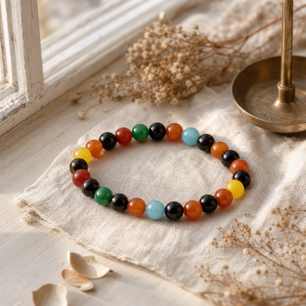 Petite Power Bracelet (17cmx6mm) - Rainbow Jade — styled in a warm, naturally lit interior