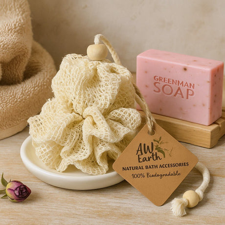 Natural bath accessories including a loofah and soap on a wooden surface with a 'Greenman Soap' bar.