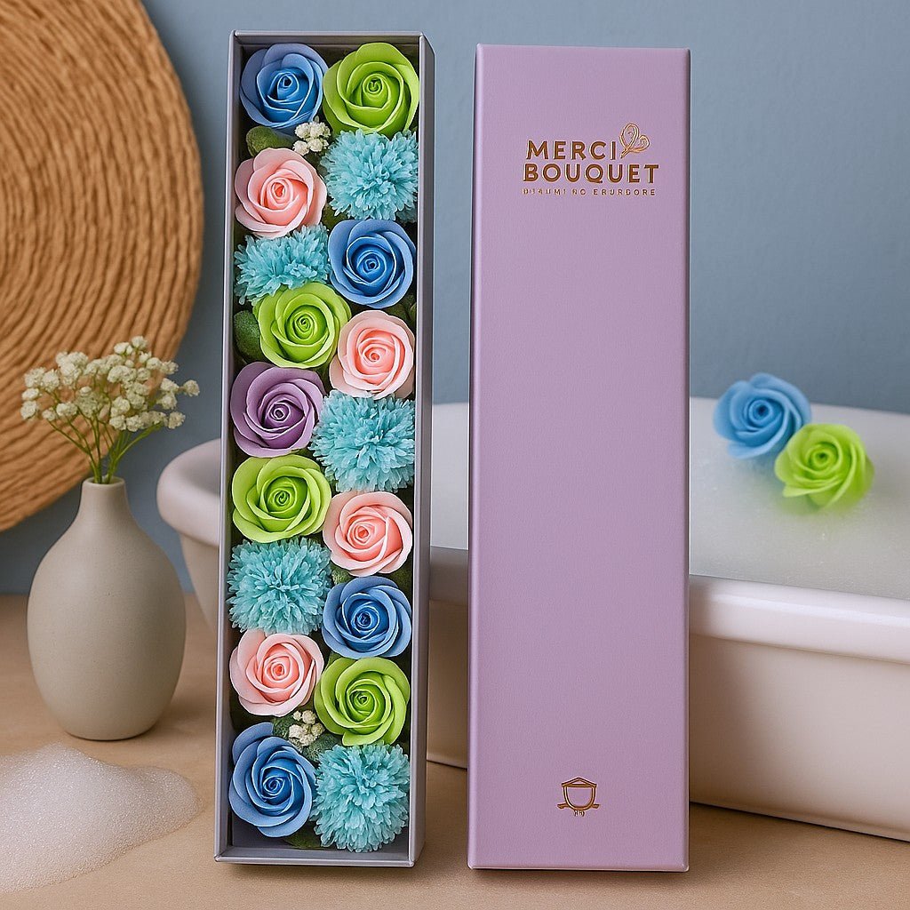 Colorful flower arrangement in a box with 'Merci Bouquet' branding on a neutral background.