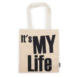Beige tote bag with 'It's My Life' text on a white background