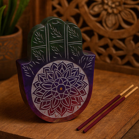 Decorative wooden Hamsa with floral patterns on a wooden surface