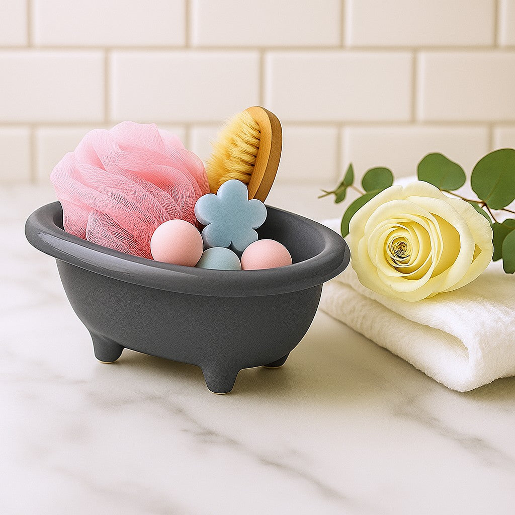 Gray bath toy organizer with various bath items on a marble surface with a tiled wall background.