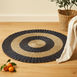 Tapete de erva-do-mar redondo preto e castanho com círculos 1m