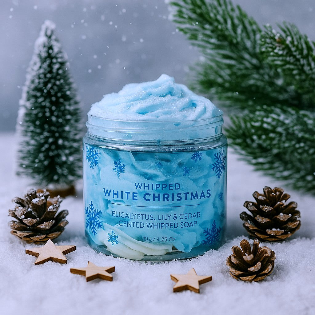Jar of 'Whipped White Christmas' soap with festive decorations on a snowy background