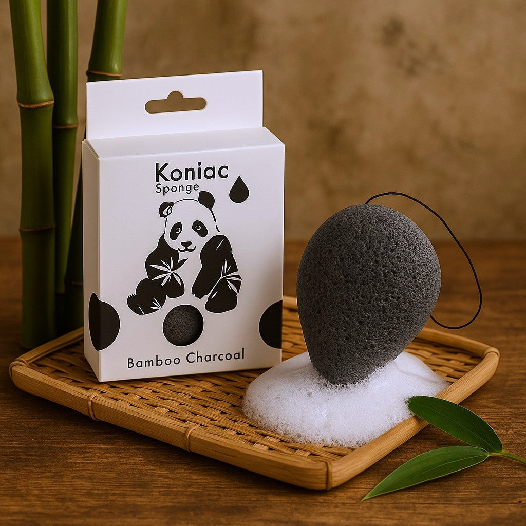 Koniac Bamboo Charcoal sponge with packaging on a wooden tray