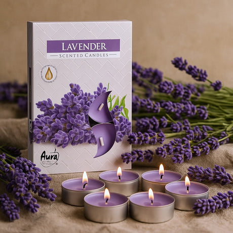 Lavender scented candles with packaging and lavender flowers on a beige background