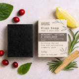 Klay Soap bar with packaging on a light surface with natural elements