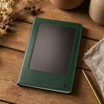A5 Intention Note Book - LCD Wipe Screen - Green Leather Effect - 80 Leafs — styled in a warm, naturally lit interior