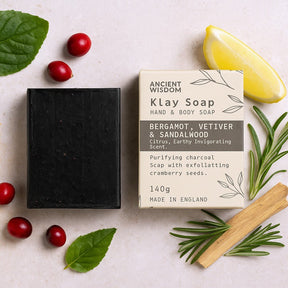 Klay Soap bar with packaging on a light surface with natural elements