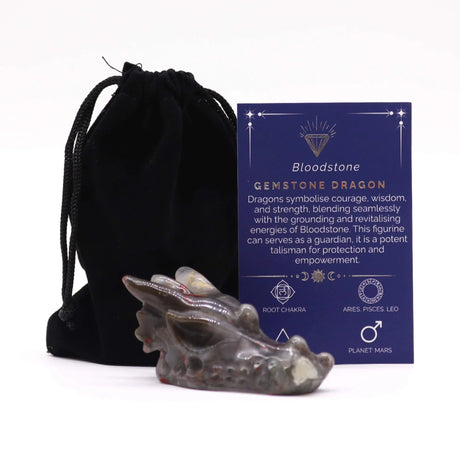 Gemstone dragon figurine with a black drawstring bag and information card on a white background