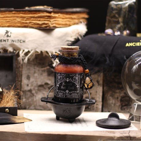 Forntida häxbadsspellotion & citrinkristallamulet – Framgång
