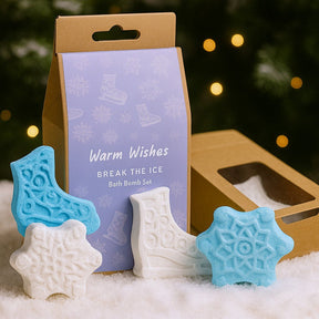 Bath bomb set with decorative packaging on a snowy background