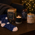 The Night Before: A Christmas Eve box for grown-ups: a brandy-butter candle, spiced tea, bamboo socks, a pillow spray and gingerbread whipped soap