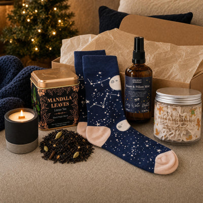 The Night Before: A Christmas Eve box for grown-ups: a brandy-butter candle, spiced tea, bamboo socks, a pillow spray and gingerbread whipped soap