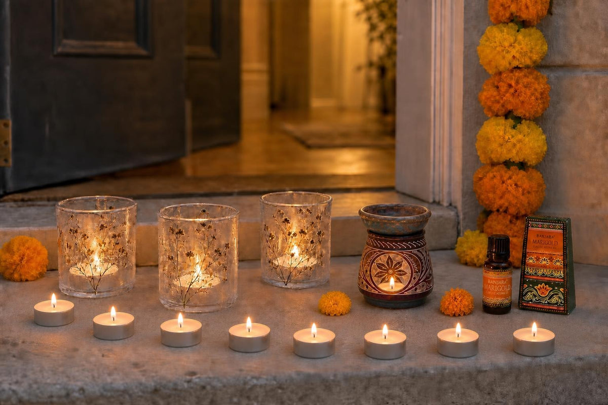 Lights by the Door: Diwali candles for the step, the sill and the door: three pressed-flower glass holders, 12 vanilla tealights, and marigold oil in a carved soapstone burner