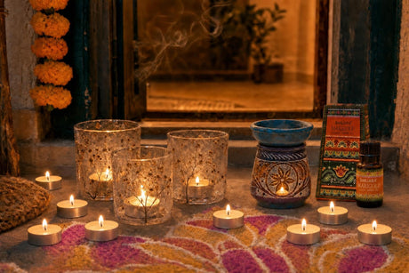 Lights by the Door: Diwali candles for the step, the sill and the door: three pressed-flower glass holders, 12 vanilla tealights, and marigold oil in a carved soapstone burner
