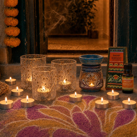 Lights by the Door: Diwali candles for the step, the sill and the door: three pressed-flower glass holders, 12 vanilla tealights, and marigold oil in a carved soapstone burner