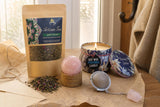 For a Hard Week: A thinking-of-you gift: a rose quartz sphere, a tea and rose tin candle, green tea with mint and rose, and a tea infuser
