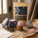 For a Hard Week: A thinking-of-you gift: a rose quartz sphere, a tea and rose tin candle, green tea with mint and rose, and a tea infuser