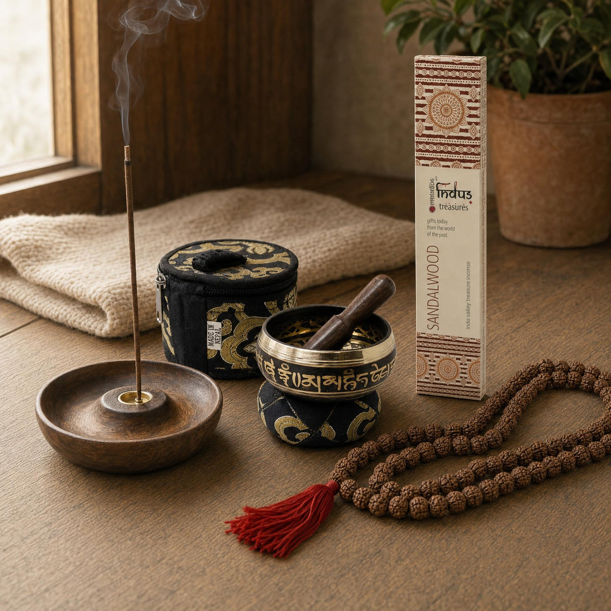 A Corner to Sit In: A meditation gift set: a small brass singing bowl with cushion and stick, hand-rolled sandalwood incense, a mango-wood holder and a rudraksha mala