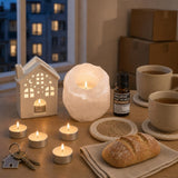 The First Evening Here: A housewarming gift: a white salt tealight holder, a little ceramic house oil burner with cedarwood oil, vanilla tealights and four jute coasters
