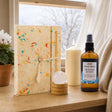 The First Page: A New Year gift: a handmade lokta journal, a clear quartz sphere, an ivory pillar candle and a lemon and pine room spray