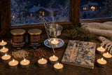 The Twelve Nights: Frankincense and myrrh for the Rauhnächte: a resin warmer with a mesh, a tub of each resin, 12 tealights and a lokta notebook