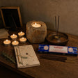 A Light Kept: A memorial gift: a petrified wood tealight holder, vanilla tealights, rosemary incense and a small notebook with a pencil