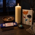 The Longest Night: A winter solstice ritual set: a tall ivory pillar, rosemary incense, a labradorite stone and a pressed-flower notebook