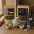 Two Cups, One Pot: A tea gift set: a jade ceramic teapot with two cups, two loose-leaf tea blends and a smoky quartz tea strainer