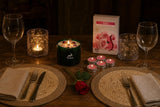 A Table for Two: A Valentine's gift set for dinner at home: a rose quartz crystal candle, two pressed-flower glass holders, rose tealights and two jute placemats