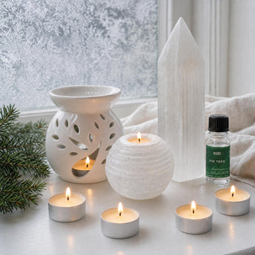 First Frost: A winter candle set in white: a selenite snowball tealight holder, a white tree burner, fir oil and a selenite point
