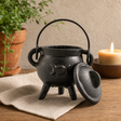 Cast Iron Cauldron with Triple Moon 6 × 10 cm — styled in a warm, naturally lit interior