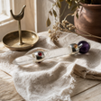 Celestial Prism Wand - Amethyst Moving Crystal Sphere Quartz Stem - 12cm — styled in a warm, naturally lit interior