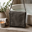 Cotton Canvas Messenger Bag - Graphite — styled in a warm, naturally lit interior