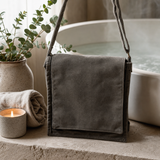 Cotton Canvas Messenger Bag - Graphite — styled in a warm, naturally lit interior
