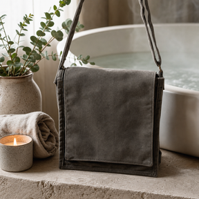 Cotton Canvas Messenger Bag - Graphite — styled in a warm, naturally lit interior