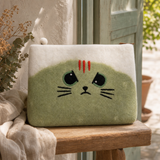 Felt Laptop Pouch (up to 14") - Grumpy Cat — styled in a warm, naturally lit interior