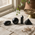 Four Gemstone Shapes - Black Tourmaline — styled in a warm, naturally lit interior