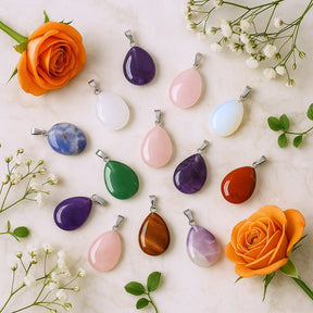 Colorful teardrop-shaped pendants on a light background with flowers