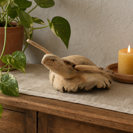Handmade Parasite Wood Art Carving - Rising Sea Turtle — styled in a warm, naturally lit interior